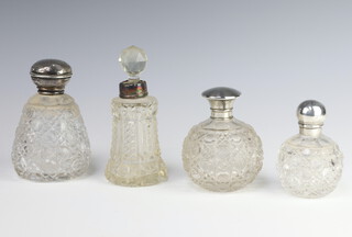 An Edwardian cut glass silver mounted scent bottle rubbed marks 8.5cm, 3 others 