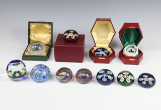 A Perthshire clematis flower paperweight boxed, a circular Perthshire paperweight boxed, ditto decorated holly boxed, ditto rose bouquet no.45 boxed and with certificate, ditto P20 (label to base) unboxed, ditto Baccarat style unboxed, ditto 1992 rose bouquet unboxed and 4 others  