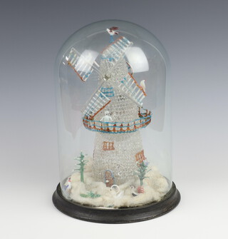 A Victorian glass novelty figure in the form of a windmill with figures to the base 29cm h, contained under a glass dome   