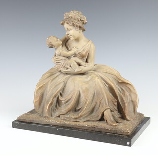 J. Dommisse, an earthenware figure of a seated lady with child, the reverse marked Made in Belgium J Dammisse 2284 33cm x 32cm 