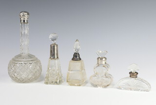A Victorian cut glass silver mounted scent bottle Birmingham 1890 19cm, 4 other mounted bottles
