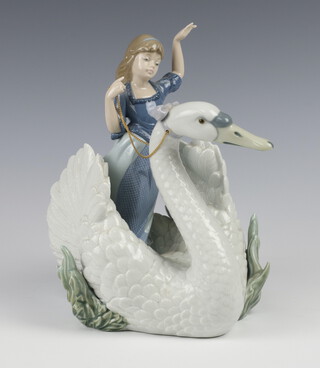 A Lladro figure group of a girl riding a swan 5705 24cm 