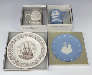 A 1975 Wedgwood blue Jasperware Christmas mug boxed, ditto 150th Anniversary of the Sailing of the Mayflower tankard boxed, ditto plate together with a Wedgwood blue Jasperware plate to commemorate the 200th anniversary of The Boston Tea party 