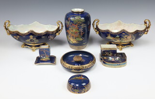 A pair of Carlton Ware blue ground chinoiserie pattern twin handled boat shaped vases 33cm, a rectangular match box stand and tray 8.5cm, a rectangular smoker's stand with ashtray and 2 receptacles 7cm  x 13cm, a circular pipe smoker's ashtray 17cm, a vase with chinoiserie decoration and a ginger jar lid 
