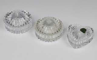 A Waterford Crystal heart shaped trinket box 8cm, ditto pair of jars and covers 8cm 
