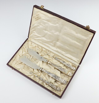 A cased set of German eaters with repousse 800 handles 