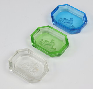 A Baccarat glass octagonal pin tray decorated a galleon 7cm (chips in places) together with a green glass ditto decorated a figure of a classical lady (some chips to edge) and a blue glass ditto 