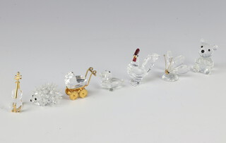 Seven Swarovski crystal figures, cockerel 5cm, bear 4cm, hedgehog 2cm, butterfly 3cm, pram 3.5cm violin 2cm and pelican 2cm