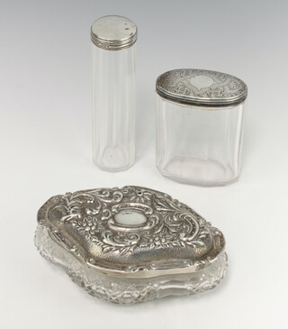 An Edwardian repousse cut glass silver lid jar with scroll decoration Birmingham 1906 14cm (holed) together with 2 mounted bottles
