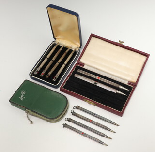 A set of 4 enamelled Sterling silver bridge pencils cased, 6 other bridge pencils