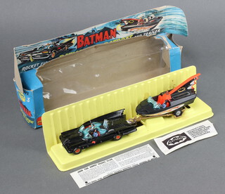 A 1st edition Corgi Gift Set no 3 "Batman Rocket Firing Batmobile with Bat Boat and Trailer"' boxed with original yellow insert and sealed instruction envelope containing rockets, missing Robin figure in Batboat