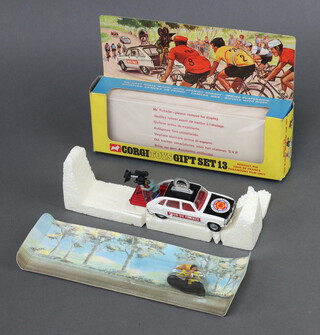 A Corgi Gift set no 13 "Renault R16 Tour De France Paramount Film Unit", boxed with shop retailer card, polystyrene fitting and racing insert (the cyclist attached to the insert in unopened bubble and car attached with original elastic to polystyrene)