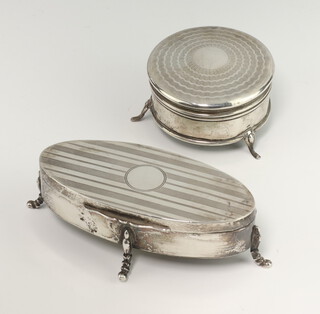 An oval silver trinket box raised on cabriole legs Birmingham 1920 11cm, a circular ditto Birmingham 1918 6cm 