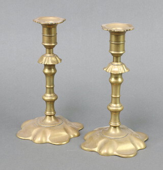 A pair of 17th Century style brass petal based candlesticks 22cm x 12cm 