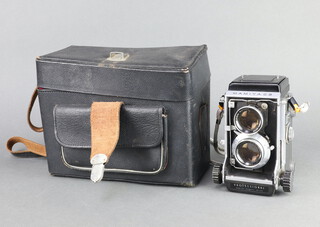 A Mamiya C3 Professional Twin-lens reflex camera, serial no. 225519 fitted Mamiya Sekor f/2.8 80mm lenses with fitted black leather case