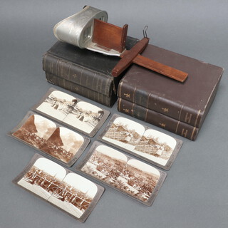 A collection of Underwood and Underwood stereoview slides of Norway (vols 1 & 2) and Switzerland (vols 1 and 2) "The Underwood Travel library" contained in faux book cases together with an Underwood and Underwood Stereoscopic viewer 