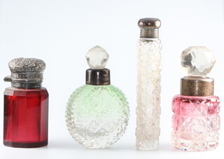 An Edwardian silver mounted red glass scent bottle Birmingham 1904, 3 other mounted scent bottles 