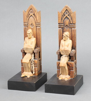 A pair of 1930's carved oak bookends in the form of seated monks 26cm h  