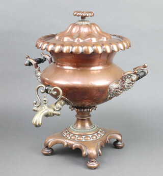 A Regency copper twin handled tea urn with brass spicket raised on a shaped base 42cm x 38cm 
