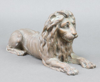 A 19th Century bronze figure of a recumbent lion 15cm x 30cm x 9cm 