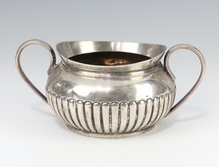 A Victorian demi-fluted silver twin handled sugar bowl London 1895, 14cm, 202 grams  