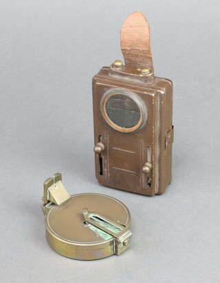 A rectangular military signalling lamp 11cm x 6cm x 3cm together with J Hicks brass cased prismatic compass 2cm x 7cm 
