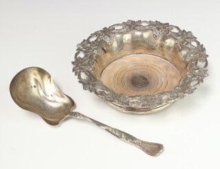 A Sterling silver serving spoon 75 grams, a plated repousse champagne coaster 