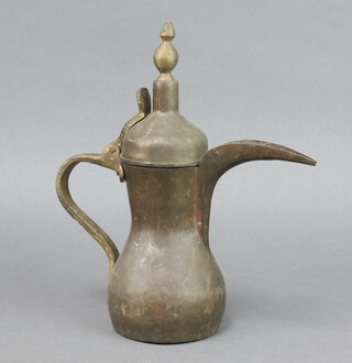 An Arabic Dallah coffee pot 27cm x 10cm, the base is unmarked 