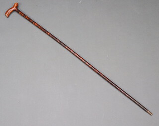 A sectional wooden walking cane 