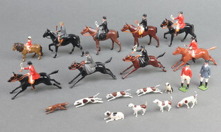 A 20 piece Britain's fox hunting set comprising master, 2 mounted huntsman, 3 ladies (2 side saddle), pony club follower, standing master, standing whip, 6 hounds, 2 terriers and a fox  