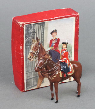 A Britain's figure HM The Queen mounted on Burmese, boxed