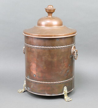 A cylindrical Art Nouveau copper and brass coal box with urn shaped lid 47cm x 26cm diam. raised on iron and brass paw feet 