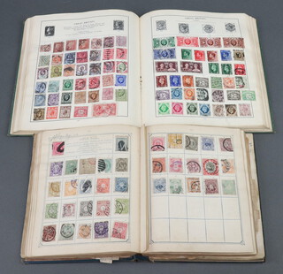 A Postage album of world stamps including GB, Peru, South Africa, North America, British Empire etc, together with a green Standard album of world stamps including GB, Penny Reds, France, Canada, etc, both albums Victoria to George VI 
