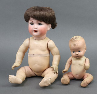 A German porcelain headed doll with sleep eyes, open mouth and 2 teeth, head incised 201SO Germany, the composition body with squeaker 16cm, together with a composition headed doll with articulated body 20cm 