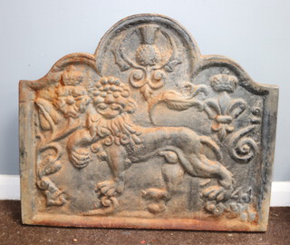 A cast iron fire back decorated thistle and standing lion 67cm x 77cm 