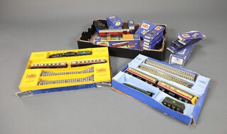 A Hornby Dublo electric train set boxed (damage to box), a DP11 Passenger Train Set Silver King locomotive tender boxed (damage to box), a T.P.O Mail van set boxed (damage to box), a 33475 T.P.O line side apparatus D1, a L12 locomotive BR Duchess of Montrose boxed together with various rails, signals, level crossing etc  