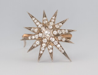 A Victorian yellow metal diamond set star brooch 5.8 grams, 35mm, approx. 1ct 