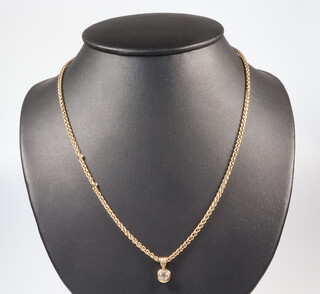 An 18ct yellow gold necklace 13.1 grams, 48cm and a yellow metal diamond set pendant approx. 0.5ct 