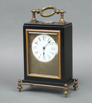 A 19th Century French 8 day carriage timepiece with 7.5cm circular enamelled dial, Roman numerals, contained in a black painted metal case, the dial surround with engine turned silvered panel, raised on brass turned feet 20cm h x 15cm w x 10cm d (no key)