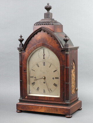 Barber and North of York, a Victorian chain driven double fusee 8 day striking on 8 bells and gong, Grand Sonnier bracket clock, the 20cm arched silvered dial with strike/silent indicator, Roman numerals, marked Barber and North York, the 17.5cm back plate signed Barber and North York, contained in a carved mahogany gothic style case surmounted by a lidded urn, complete with pendulum and key 65cm x 22cm x 33cm