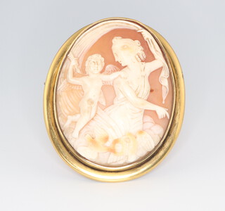A Victorian gilt metal mounted cameo brooch decorated a lady and cherub 6cm x 5cm 