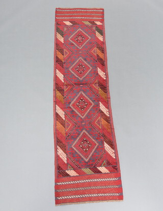 A red and blue ground Meshwani runner with 4 diamonds to the centre 234cm x 58cm 