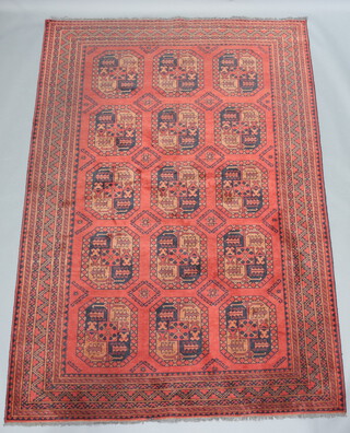 A red and black ground Afghan rug with 15 octagons to the centre within a multi row border 289cm x 201cm 