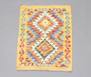 A yellow, white and orange ground Chobi Kilim rug with 2 diamonds to the centre 86cm x 60cm  