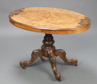A Victorian oval quarter veneered and figured walnut Loo table, raised on carved pillar and tripod base 73cm h x 93cm w x 71cm d 