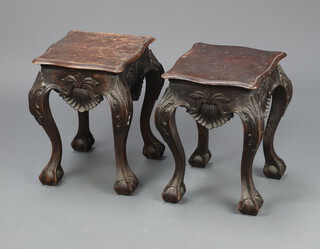 A pair of 19th Century Chippendale style carved mahogany urn tables of serpentine outline, carved shells, raised on cabriole supports 38cm h x 28cm w x 27cm d 