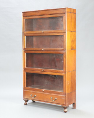 A 1930's mahogany 5 tier Globe Wernicke style bookcase enclosed by glazed panelled doors, the base fitted a drawer, raised on turned supports 61cm h x 86cm w x 31cm d 