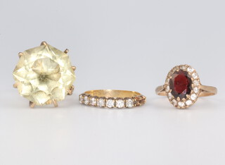 A 9ct yellow gold high mount cocktail ring, size M, a garnet set ditto size K and a 7 (ex 9) set gem set ring size L, gross weight 12.5 grams 