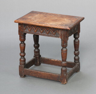 A 19th Century carved oak joined stool with carved apron, raised on turned and block supports 45cm h x 44cm w x 28cm d