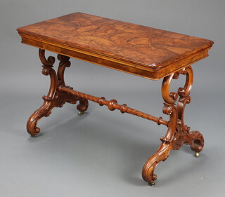 A Victorian rectangular quarter veneered figured walnut card table, raised on shaped supports with spiral turned stretcher 73cm h x 97cm w x 56cm d 